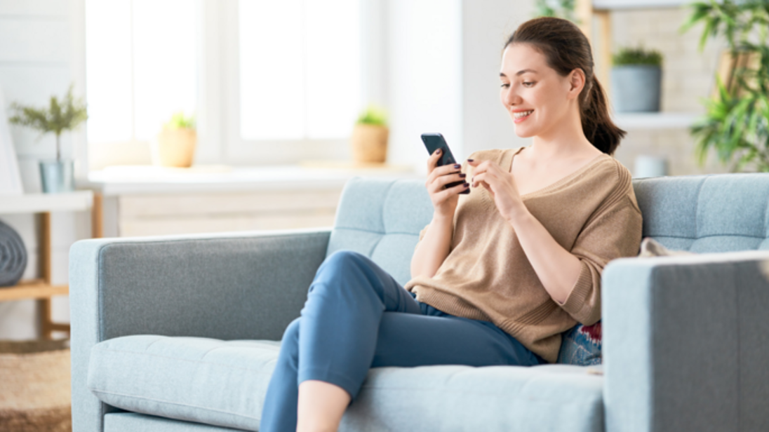 Ph Pic Casual Woman Talking Phone Sitting Sofa 1422270389 Ne